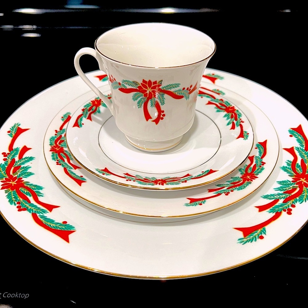 “Poinsettia and Ribbons” Fine China 12 plus place setting